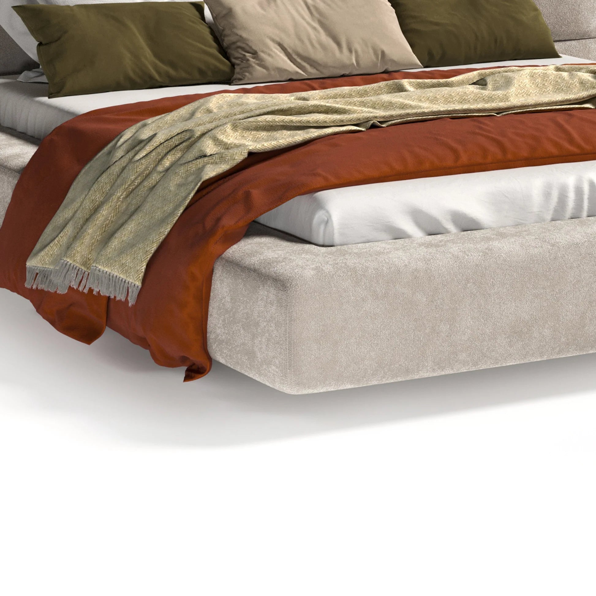 Beige bed with brown blanket and green pillows on a white background